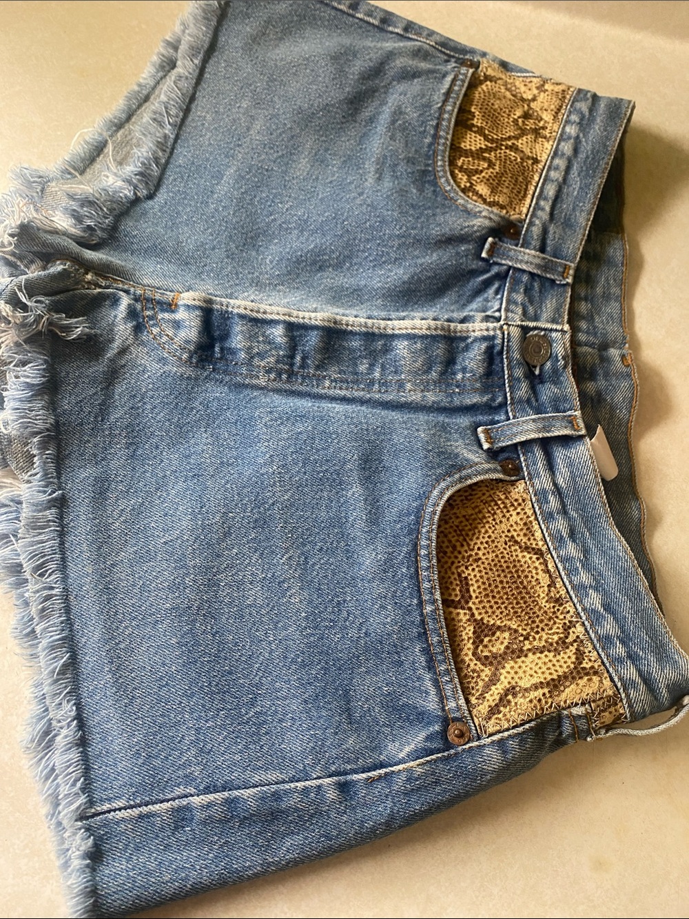 Urban Outfitters Light Blue Denim Shorts with Snake-Print Pocket Trim